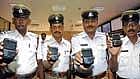 Generation Smart: Traffic police officers displaying the Black Berry smart phones, which they received at the launch of Black Berry Plan 2nd phase for traffic police, organised at Traffic Management Centre in Bangalore on Wednesday. DH Photo