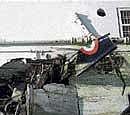 The mangled remains of the plane that crashed into a building in Hyderabad on Wednesday. AP