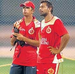 Keen observers: Rahul Dravid (left) and Praveen Kumar during RCBs practice session on Tuesday. DH photo