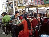 enjoying Customers relishing South Canara food.