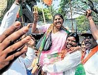 Exuberant: BJP supporters celebrating during nomination filing at Shivajinagar BBMP office, Queens Road in Bangalore on Monday. DH Photo