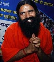 Yoga Guru Baba Ramdev addresses a press conference in New Delhi on Tuesday. AP