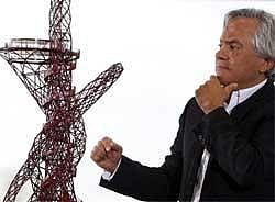 Artist Anish Kapoor looks at a model of his design of the ArcelorMittal Orbit at a press conference in London on Wednesday, AP