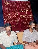 The arrested along with the seized gold. DH photo