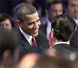 President Barack Obama greets attendees during the opening plenary session at the Nuclear Security Summit in Washington on Tuesday, AP