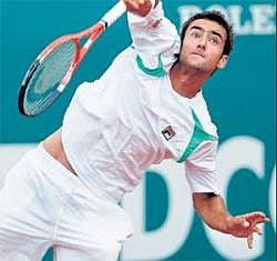 on the line Croatias Marin Cilic serves during his second round match against Igor Andreev in Monte Carlo. afp