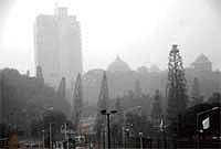 Spot the Soudha: Sudden downpour created a misty effect around Vidhana Soudha in Bangalore on Wednesday evening. DH Photo