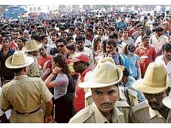 The spectators, who had come to Chinnaswamy Stadium to watch the IPL cricket match between Royal Challengers Bangalore and Mumbai Indians were shocked to hear the blast news. dh photo