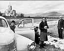 On the road: Cartier-Bressons The Modern Century. A 1972 photo of a Georgian family picnicking near a monastery.