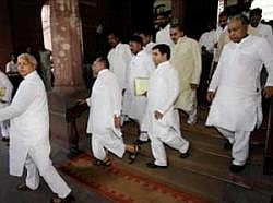 Lalu Prasad and Mulayam Singh Yadav come out of Parliament House in New Delhi on Tuesday. PTI