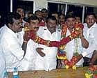 Victor V Prakash (fourth from left) being congratulated by supporters after he was declared elected unopposed for the third term for Kolar CMC. Balaji Chennaiah, V K Rajesh, K M Madhusudan Kumar, legislator R Varthur Prakash and Routh Shankarappa are seen. DH photo