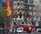 In this file photo, fire tenders try to douse fire at the ground and first floor of the Taj Hotel in South Mumbai during security personnels Operation Cyclone following the terror attacks in November 2008. PTI