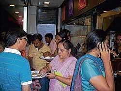 delicious Customers relishing the food.