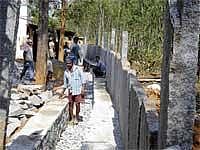Villagers constructing drainage system at Dodda Aralagere Gram Panchayat under  Mahatma Gandhi National Rural Employment Guarantee Scheme.  DH Photo