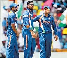 Crucial day: India need big efforts from Yusuf Pathan (left) , Yuvraj (centre) and Suresh Raina against Windies on Sunday. AFP
