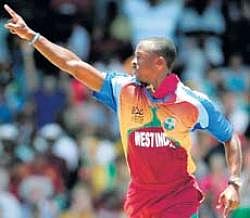 Blowing hot: West Indies Kemar Roach celebrates the dismissal of Indias Gautam Gambhir on Sunday. AP