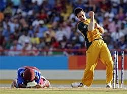 Australia's Mitchell Johnson, right, celebrates after running out West Indies' batsman Dwayne Bravo at a Twenty20 Cricket World Cup match in Gros Islet, St. Lucia on Tuesday, AP
