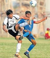 No holds barred: Sovan Chakraborty (left) and Inacio  Colaco of SESA battle for possession on Wednesday. DH photo