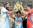 Indian skipper Rajpal Singh (left), Arjun Halappa and Korean Kim Yong-bae with the trophy. Reuters