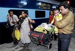 Survivors of the Gyaneshwari Express train at Midnapur on their way back to Mumbai in the Howra-Kurla Relief train on Saturday night. PTI