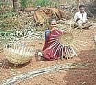 Pakeeramma of Koracharahatti in Kadur taluk weaving a basket. dh photo