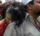 tragedy onboat: A volunteer takes a victim of a boat  tragedy to hospital in Ballia, Uttar Pradesh, on Monday. pti