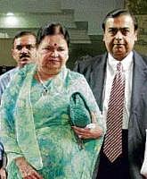 RIL Chairman Mukesh Ambani with mother Kokilaben arriving for AGM in Mumbai on Friday. AP