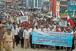 dissent: A protest rally being held against the Karnataka Prevention of Slaughter and      Preservation of Cattle Bill 2010 in Madikeri on Wednesday.  DH Photo
