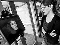 artificial intelligence Anne Loomis, a software development engineer with Microsoft Research, interacts with Diane, a computational personal assistant that is used to manage schedules, in Redmond, Washington. NYT