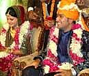 Cricket captain Mahendra Singh Dhoni and Sakshi Singh Rawat during their marriage ceremony in Dehradun. PTI