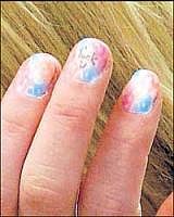 A detail of Lindsay Lohans hand shows profane language on her nail. AP