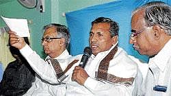 Plans Afoot: Union Minister of State for Railways K H Muniyappa (centre) addressing the media in Bangalore on Thursday. Divisional Railway Manager Akhil Agarwal and Chief Administrative Officer S Vijaya Kumaran are seen. DH Photo