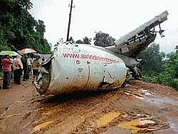The mangled remains of Air India Express IX 812 kept on the road as villagers were holding protest at Kenjaru near Bajpe in Mangalore on Friday. DH Photo