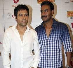 Indian Bollywood actors Emran Hashmi (L) and Ajay Devgan pose during a promotion of their forthcoming Hindi film "Once Upon a Time in Mumbai" in Mumbai. AFP Photo