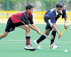 St Germains Noel Omar Abbas (left) and FAPS Nalin K vie for possession at the Fr Eric Vaz meet. DH photo