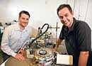 INNOVATORS: Chemist and researcher Erik Sher and molecular biologist Alex Tkachenko with a mass spectrometer. (Jim Wilson/The New York Times)