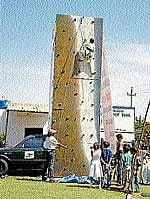 Children practising rock climbing on the mobile wall at Rotary Mid Town School in Mysore. DH PHOTO