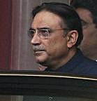 Pakistan President Asif Ali Zardari leaves the rally of Pakistan People's Party in Birmingham, England, Saturday, Aug. 7, 2010. AP