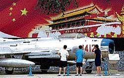 Visitors to the China Aviation Museum look at an old Peoples Liberation Army Air Force F-6B fighter jet on display. Reuters