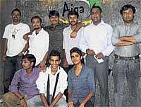 Proud Moment: The AIGA team celebrates with their two mentors (extreme right).