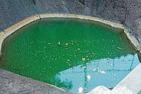 (Top) A splendid view of the Narahari Parvatha. (Below) The Chakratheerthakoopa at the Narahari Sadashiva temple premises, near B C Road.