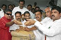 Wheat Bowl: Minister R Ashok (right), Bangalore Mayor S K Nataraj (second from right) and legislators at the rice and wheat mela organised by Food and Civil Supplies Department at National College grounds in Bangalore on Thursday. DH Photo