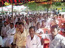 People participating in the public meet organised by  Congress at Chaulahiriyur in Kadur taluk on Wednesday.