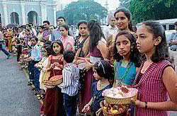 Children waiting with flower baskets to offer to Mother Mary as a part of Blessed Virgin Marys feast in Milagres church on Wednesday. DH photo