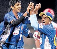 Mysore Maharaajas skipper Chetan William (right) congratulates his hitman Tarun Muthanna on Friday. DH photo