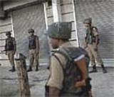 Indian Security Force officers stand guard in the street after officials lifted the curfew for a period of four hours in Srinagar, India on Saturday. AP Photo