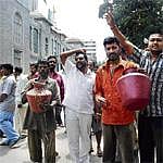 BBMP public toilet workers soak themselves in night soil as a mark of protest in front of BBMP head office on Thursday. KPN
