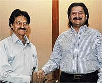 Newly-elected president of the Indian Newspaper Society (INS) for the year 2010 -11 Kundan R Vyas (left), Chief Editor of Janmabhoomi, being greeted by the outgoing president T Venkattram Reddy at the 71st Annual General Meeting held in Bangalore on Friday. DH Photo
