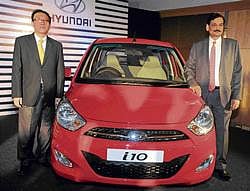 Hyundai South Zone - Sales & Marketing Head Y S Kim and Director Marketing Arvind Saxena, launching the new Hyundai i10 in Bangalore on Saturday. DH PHOTO