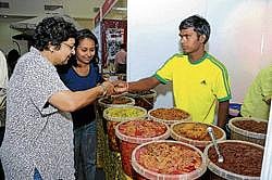 Digging in: Visitors at the stall.